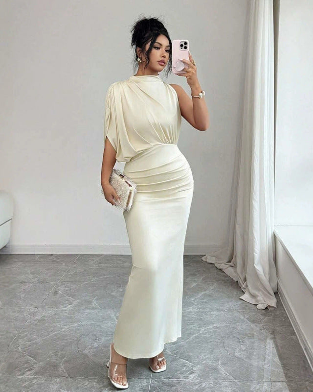 Close-up of the draped design and fluid sleeve of the Mirella satin dress